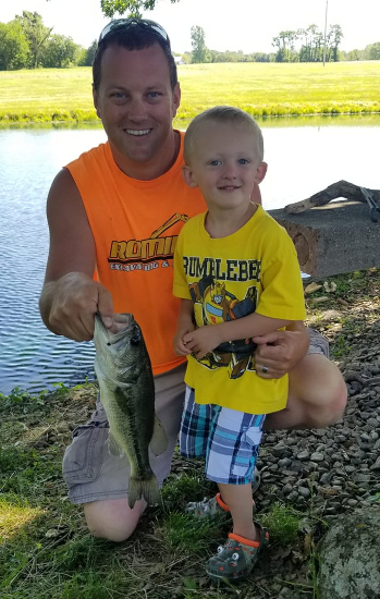 Scott Romine, Owner of Romine Excavating & Septic, with his son Mason and his first fish!